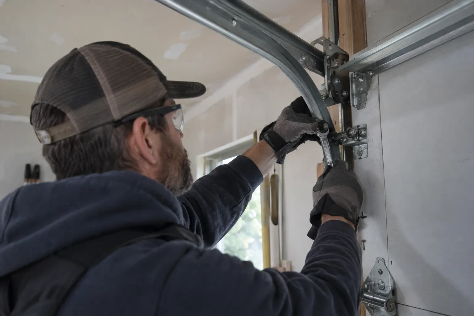 Illustrative garage doors scene; not an actual job